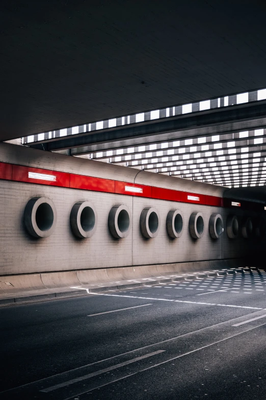 the empty tunnel on a train station with light on