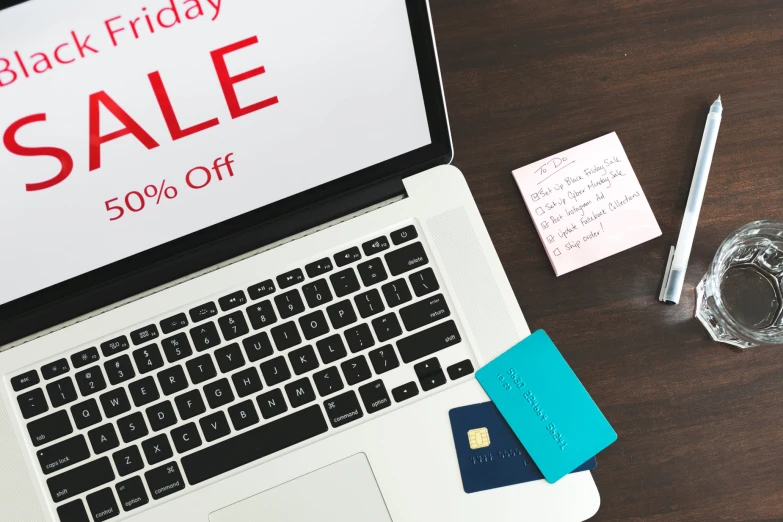 a black friday sale written in red is on a laptop