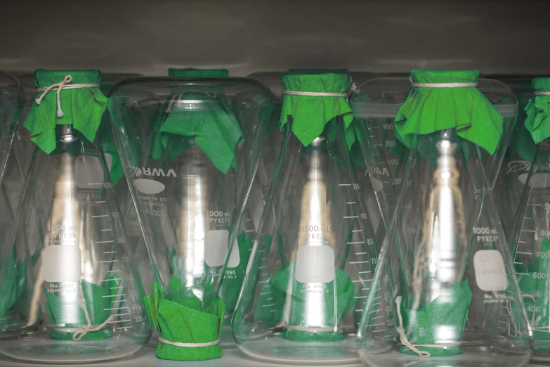 the bottles are full and in different shapes and colors
