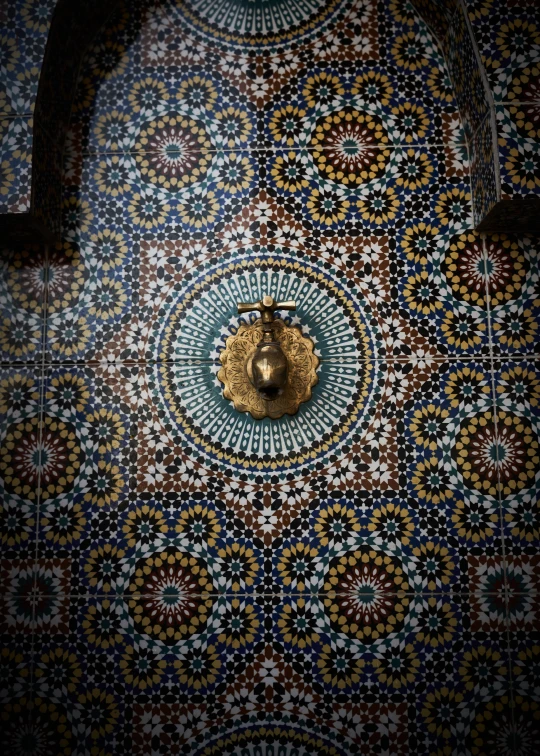 the interior of a restaurant decorated with blue and yellow tiles