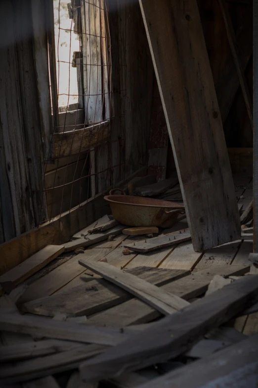 a room that has broken down and has wooden floors