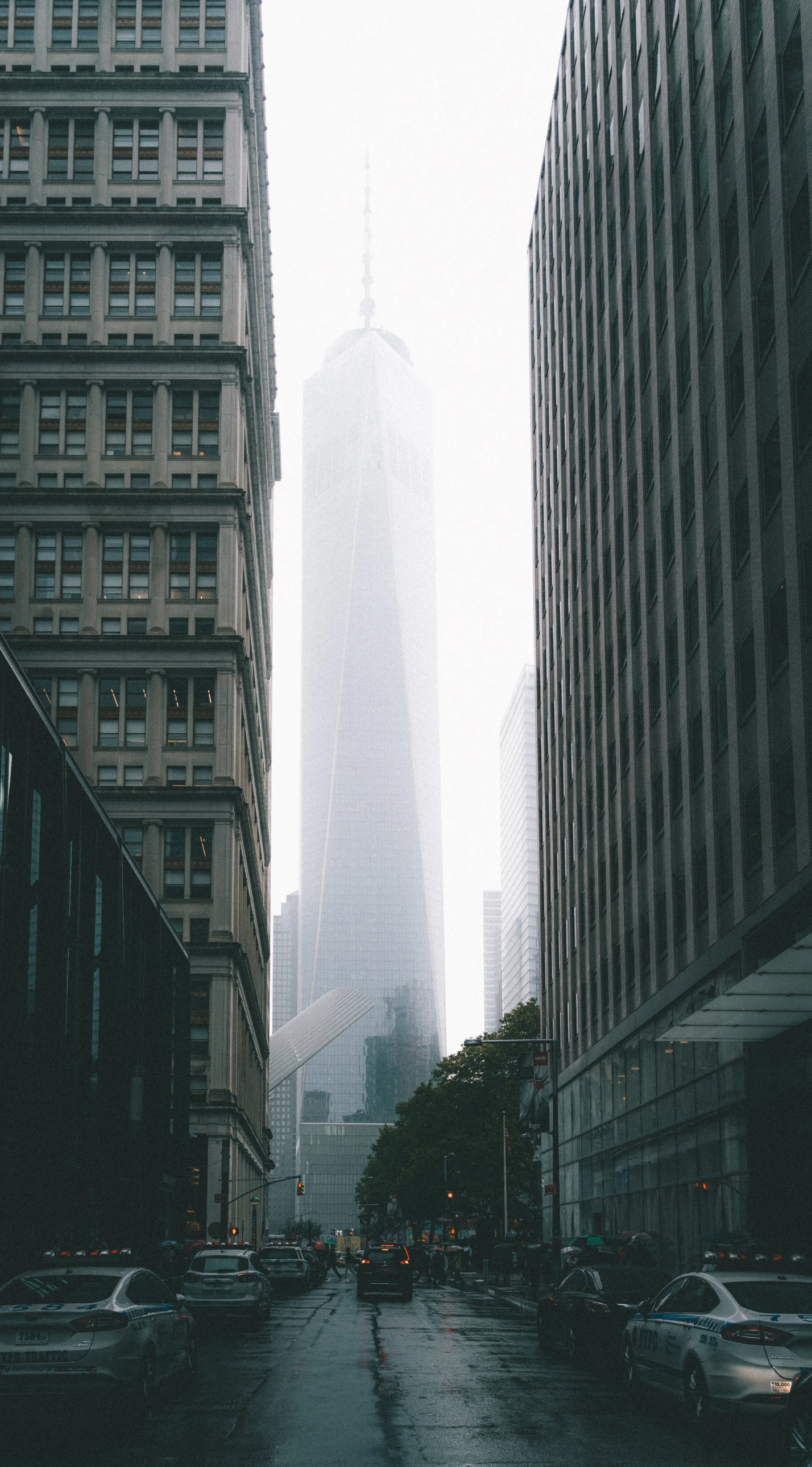 some very tall buildings in the middle of a street