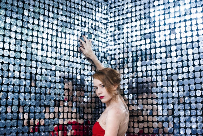 a girl taking a selfie in a mirror with the lights on