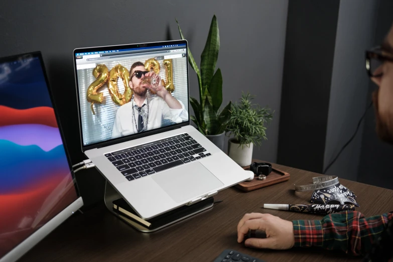 a man works on his macbook pro