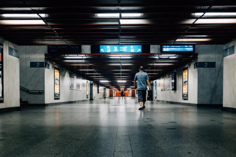 a man is standing alone in a tunnel