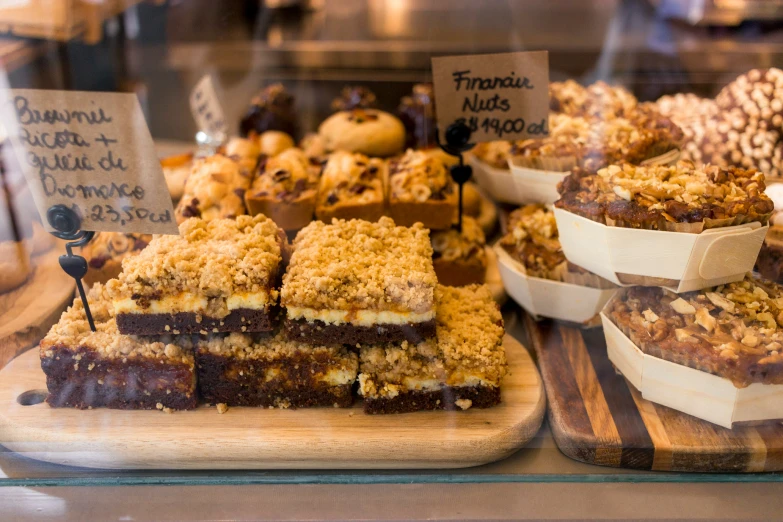 there are many desserts on display in this display case