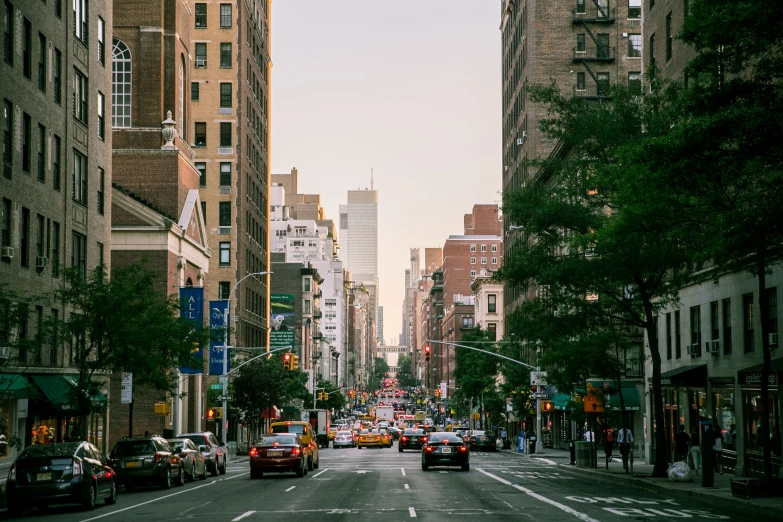 the view of a crowded city street from an intersection