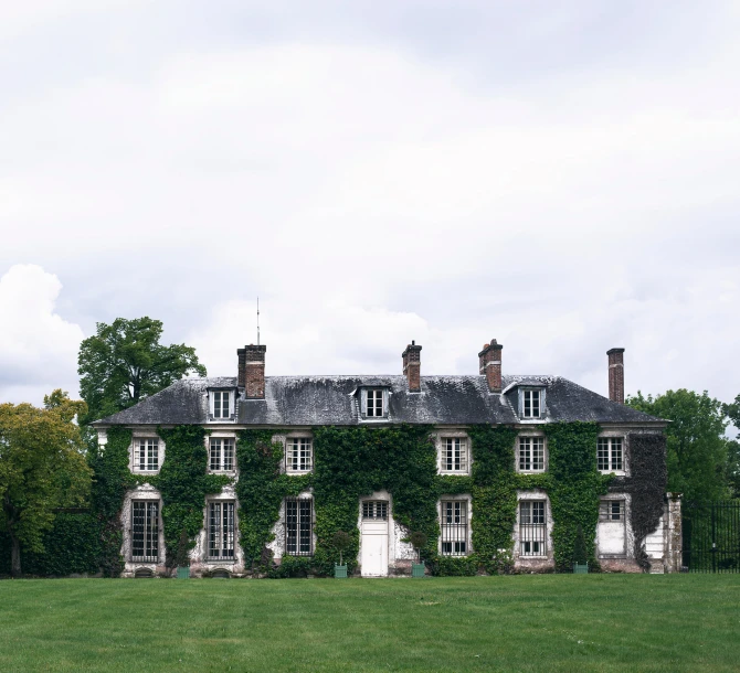 a house with ivy growing over the top