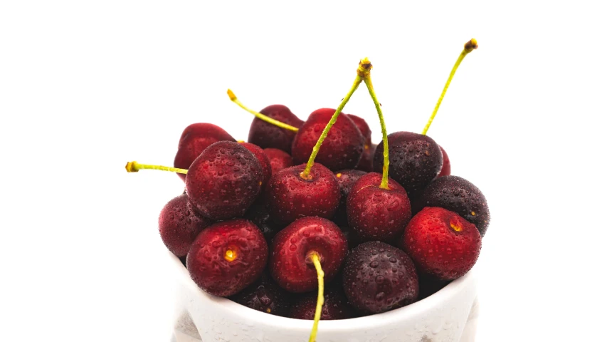 closeup of a bunch of cherries in a bowl