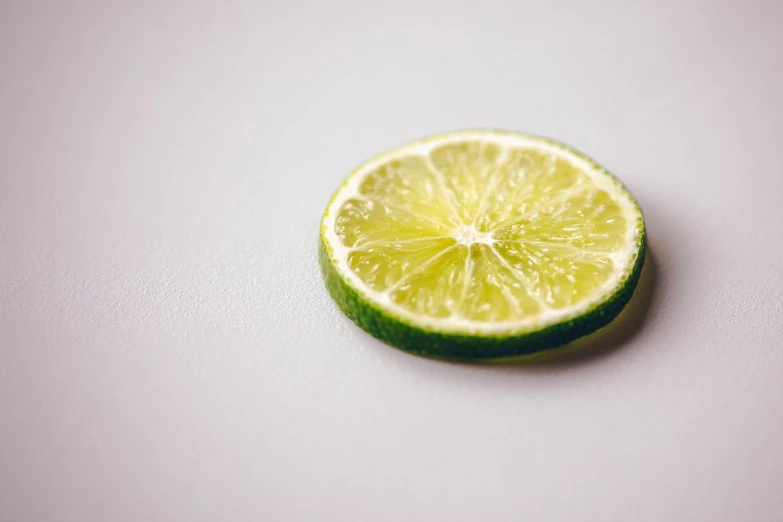 the lemon is cut in half to show its fruit flavor