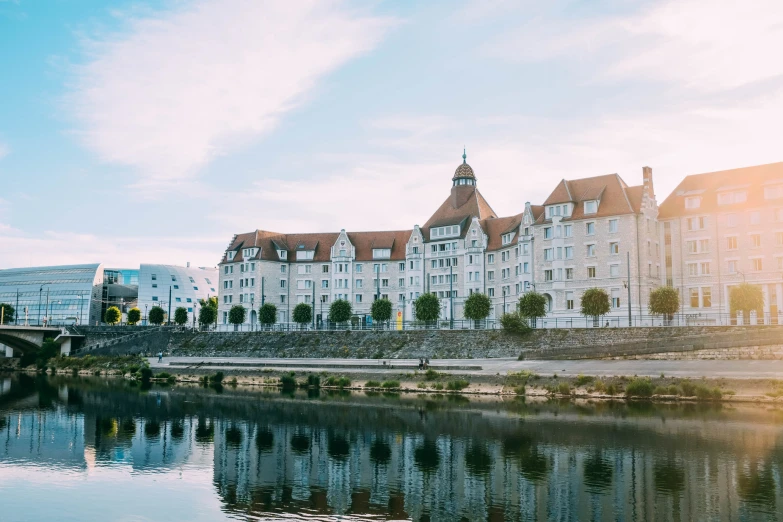 a very large and fancy el building next to a river