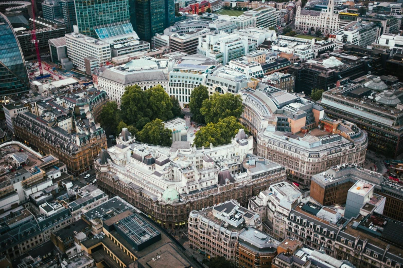 an aerial s of a circular building in the middle of the city