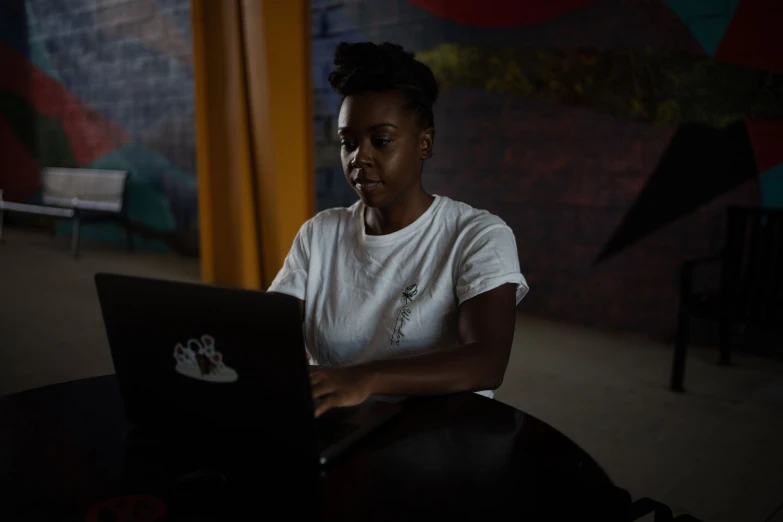 an image of a woman on her laptop