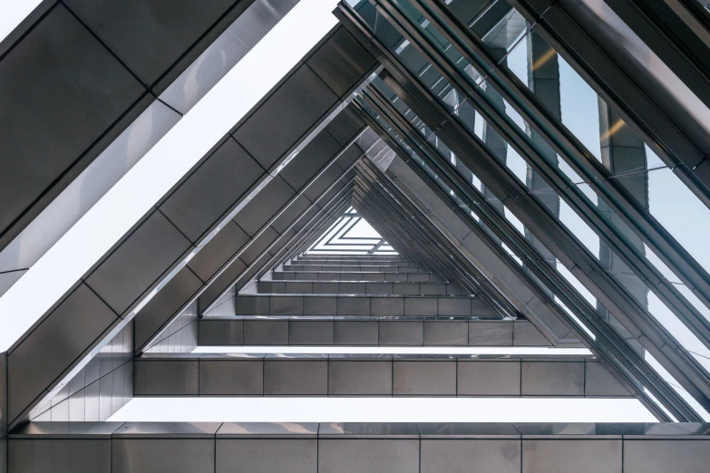 a series of gray triangles and steps at an airport