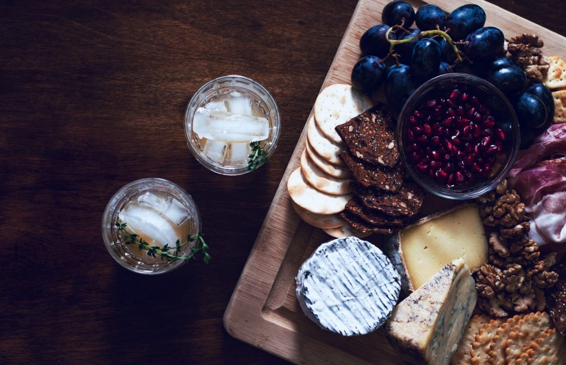 a  board topped with gs and other foods