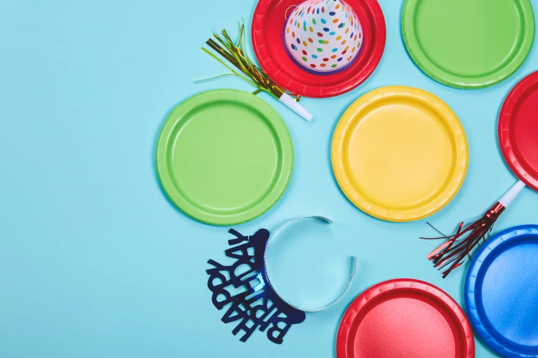 colorful plates and items displayed on a blue background