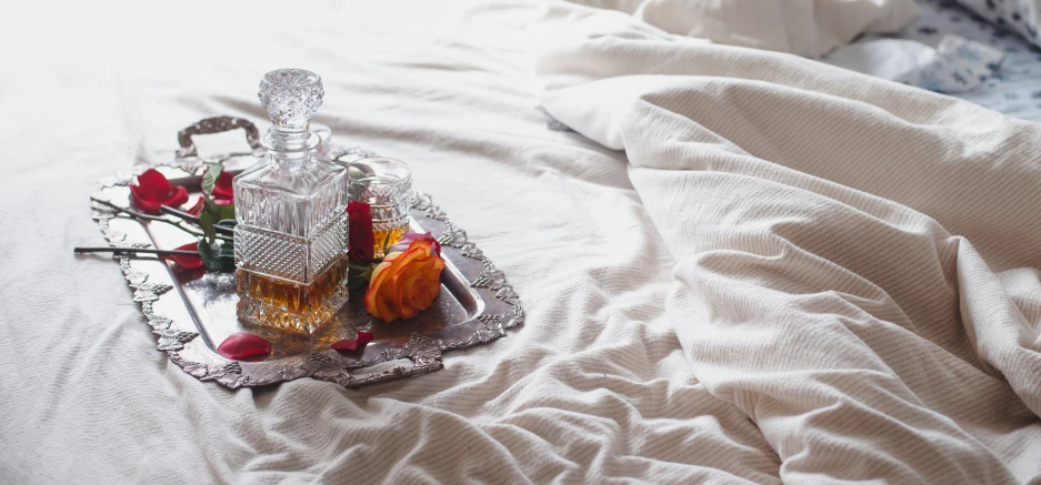 two bottles of liquor on a silver tray