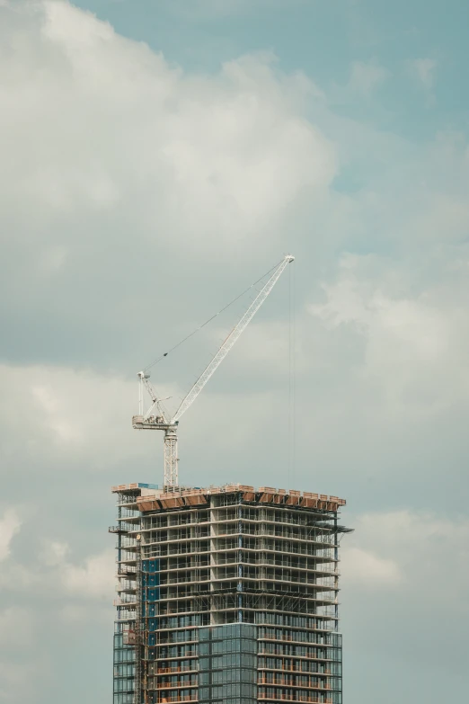 an industrial building is under construction with cranes