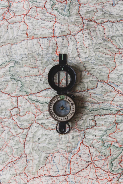 a map with a compass laying on it