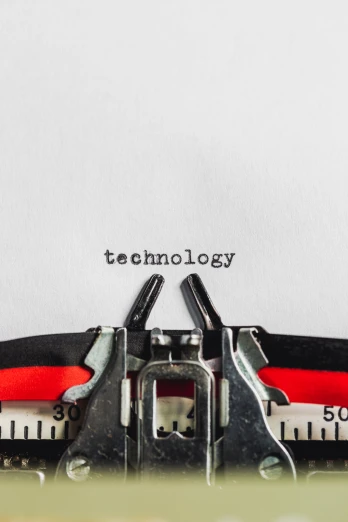an old typewriter with words technology printed on the paper