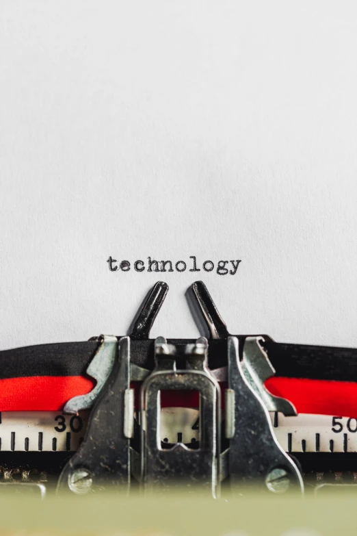 an old typewriter with words technology printed on the paper