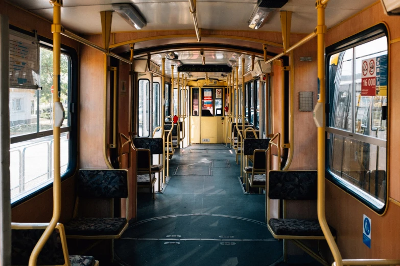 the inside of a subway bus looking at its windows