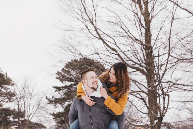 a man is sitting on the back of a woman's shoulder