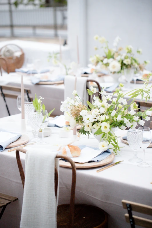 a white and blue table is shown with place settings