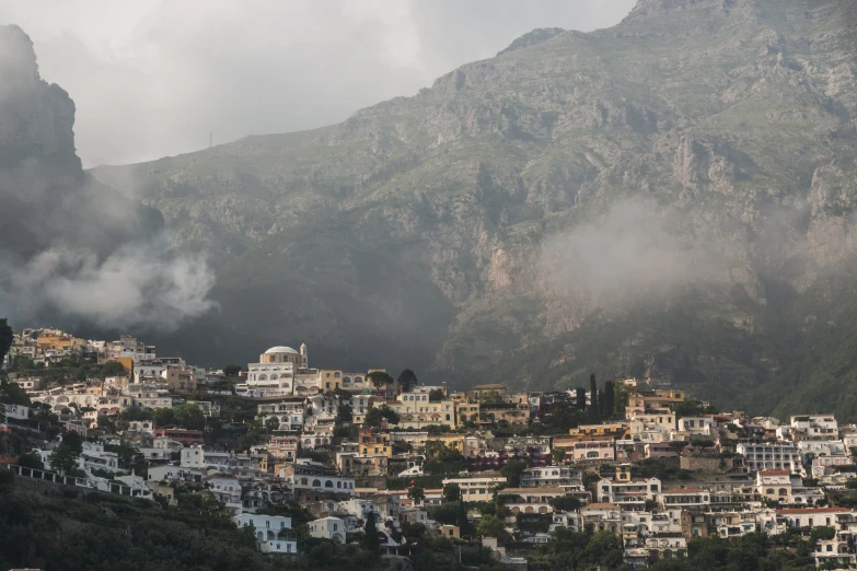 an aerial view of some buildings in the mountains