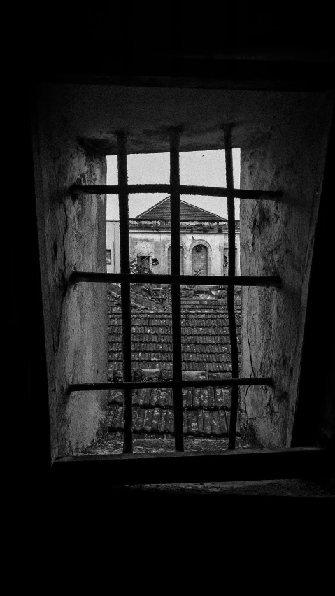 the inside of a  cell with bars hanging from it