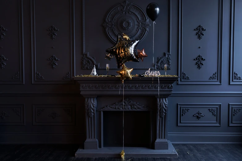 an ornately decorated fireplace in a dark room