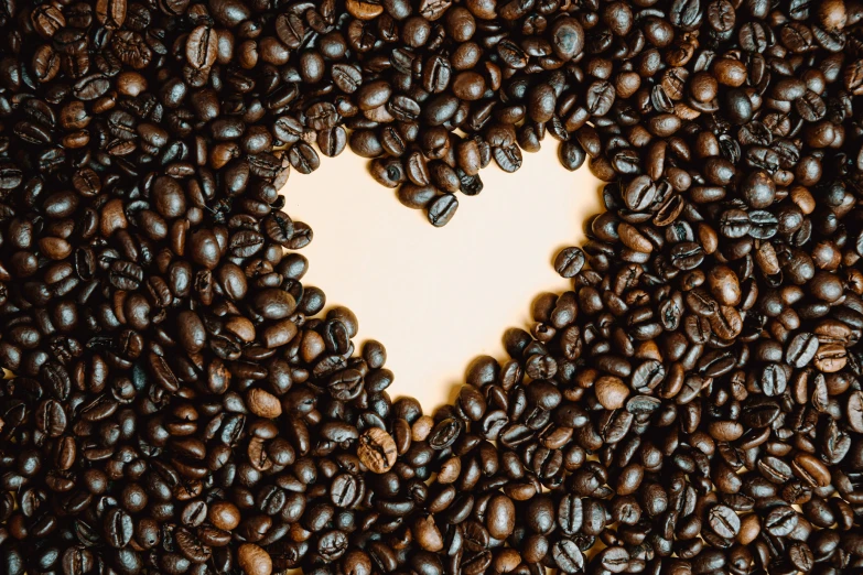 there is a heart made out of coffee beans