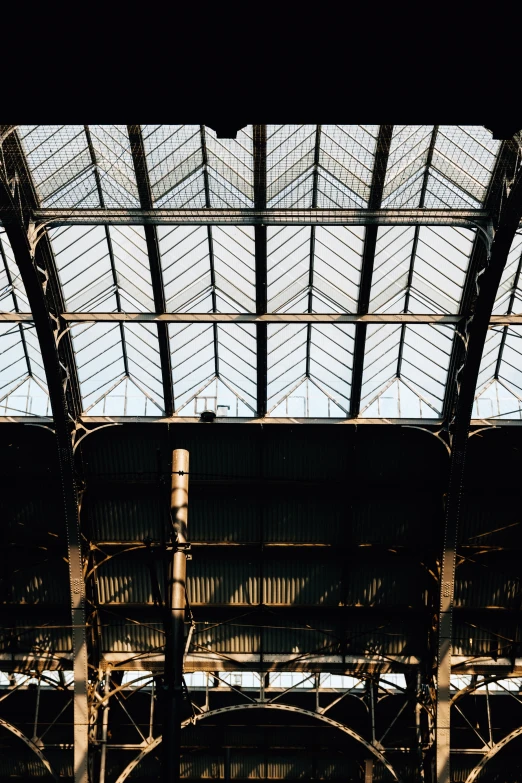 the inside of a train station where many windows are shining