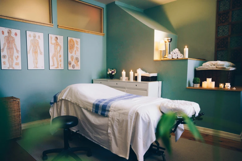 the back of a woman's hospital bed has several candles in it