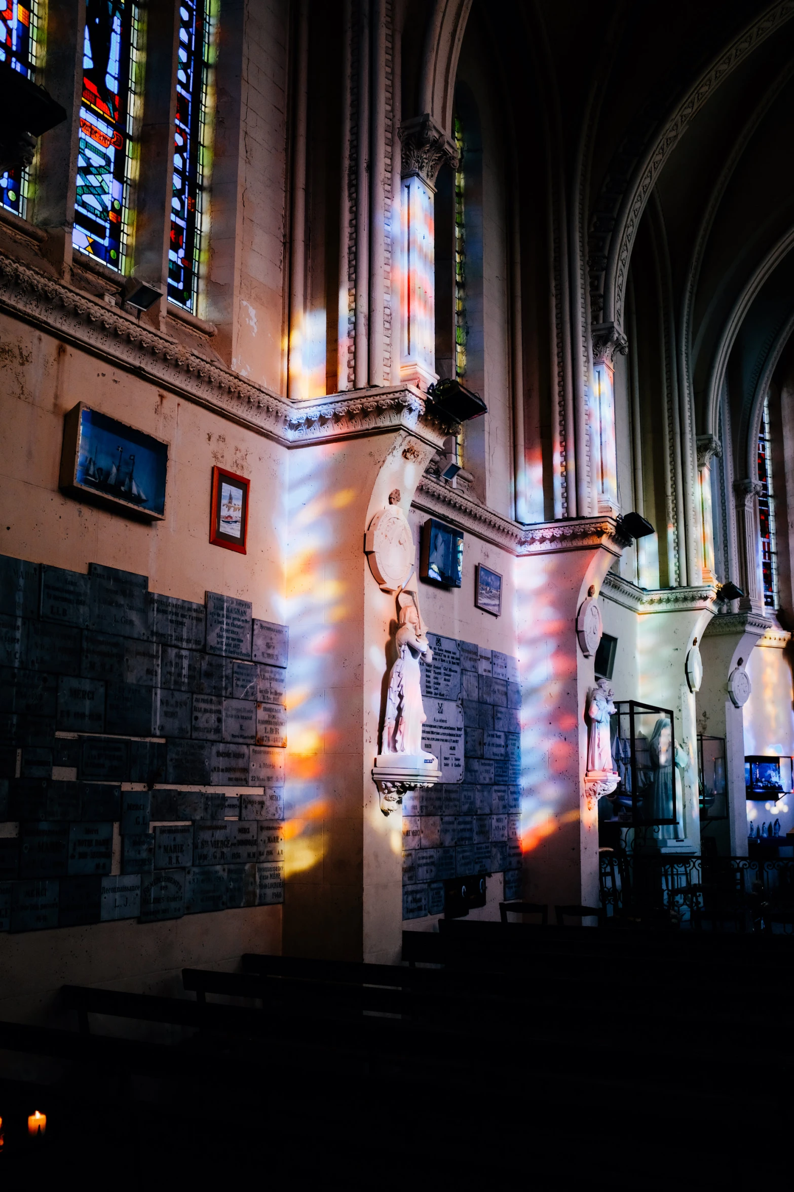 sunlight streams through the stained glass windows in the cathedral