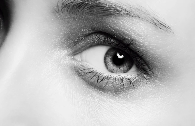 close up of human eye with black and white background