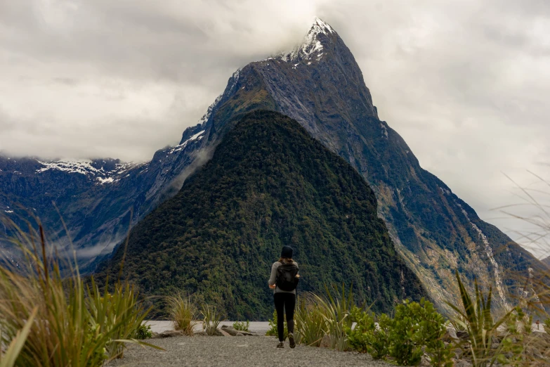 a person standing on top of a gravel road