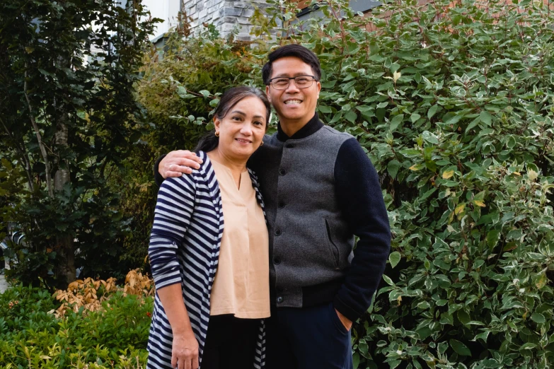 a young man and woman posing for a picture