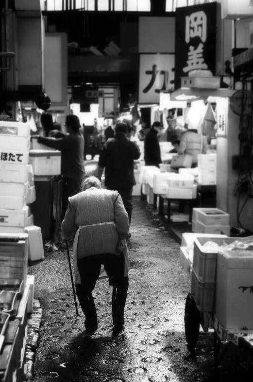 a man is walking through the food market