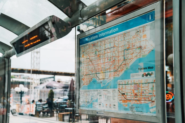 a train station with the map for a public transportation system