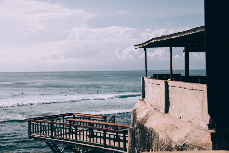 a couple of buildings sit near the beach