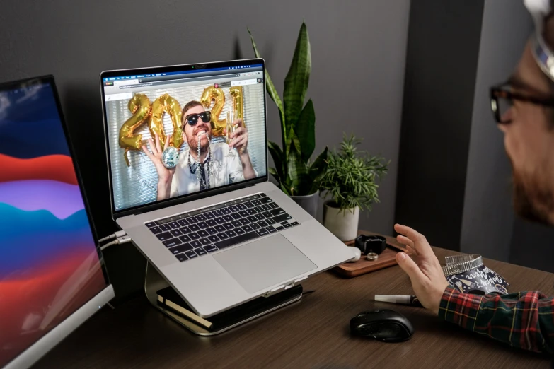 the young man is doing soing on the computer screen