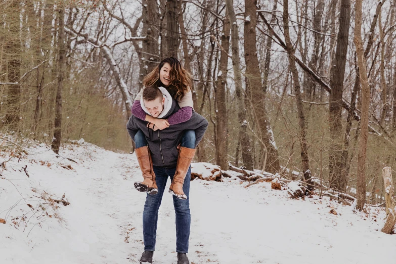 a man and a woman that are standing in the snow