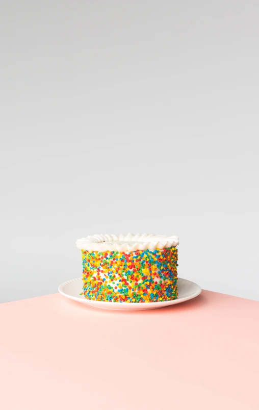 a cake is sitting on a plate with frosting