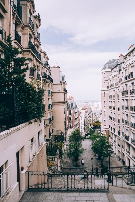 a view looking down at the city from a balcony