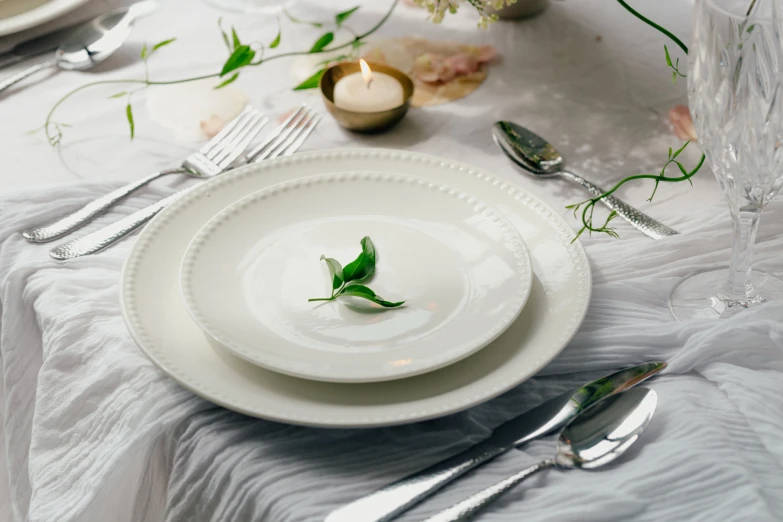 a table topped with plates filled with food