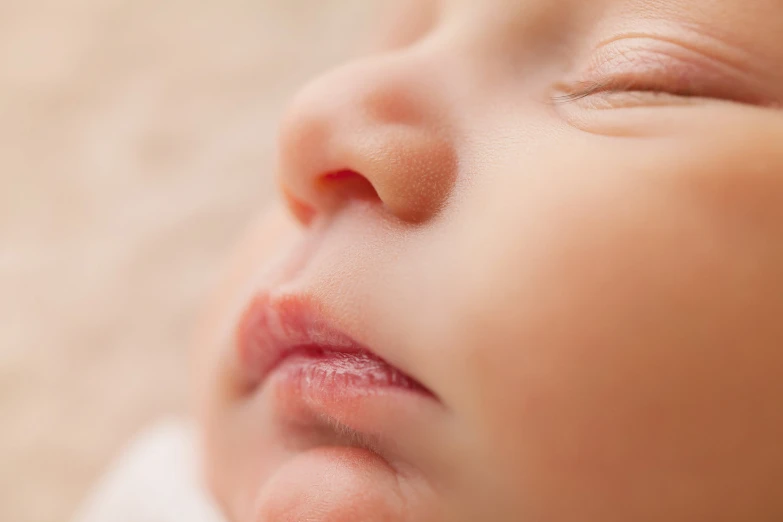 a small child sleeping with its mouth open