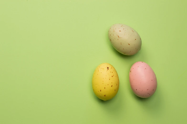 three chocolate eggs and two colored ones