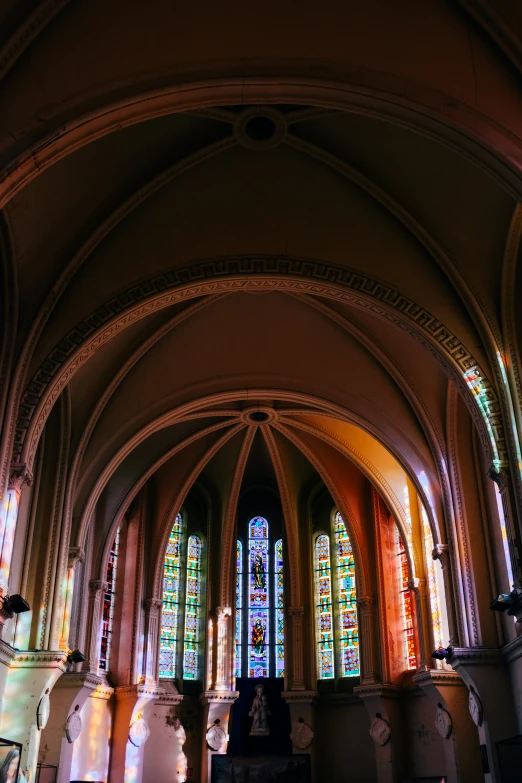 the room is decorated with stained glass windows