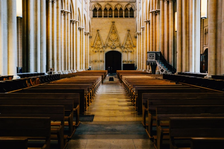 an empty cathedral with pews and high ceilings